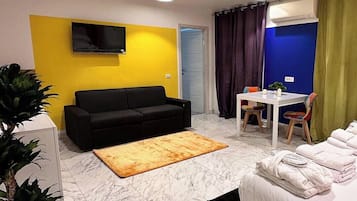 Habitación triple Deluxe | 2 dormitorios, sábanas italianas Frette, ropa de cama de alta calidad