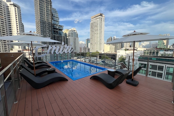 Outdoor pool, open 8:00 AM to 8:00 PM, pool umbrellas, pool loungers