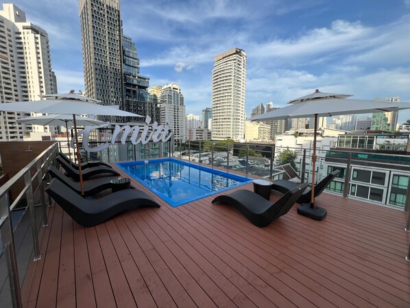 Outdoor pool, open 8:00 AM to 8:00 PM, pool umbrellas, sun loungers