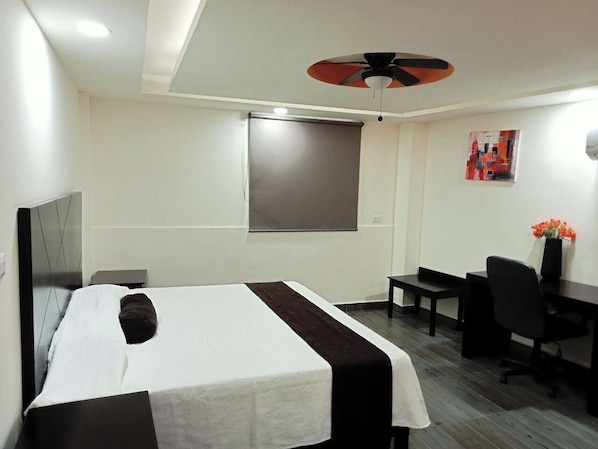 Deluxe Room, 1 King Bed | Desk, laptop workspace, free WiFi, bed sheets