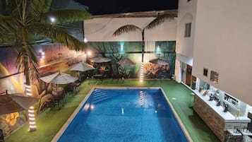 Outdoor pool, open 8:00 AM to 10:00 PM, pool umbrellas