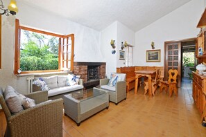 Family House, Multiple Bedrooms, Sea Facing (Villino Saline) | Living area | TV, fireplace - Villino Saline (Orbetello)