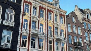 A row of historic buildings with ornate facades and large windows. - THE FRITZ HOTEL Amsterdam (Amsterdam)