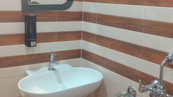 Shower, towels, soap, toilet paper