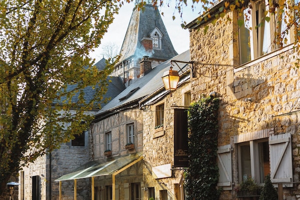 Authentic Ardennes street with church tower near Durbuy and Clavier. A perfect backdrop for exploring Belgian heritage towns.