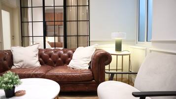 Deluxe Apartment, 2 Bedrooms, Kitchen | Living area | Flat-screen TV