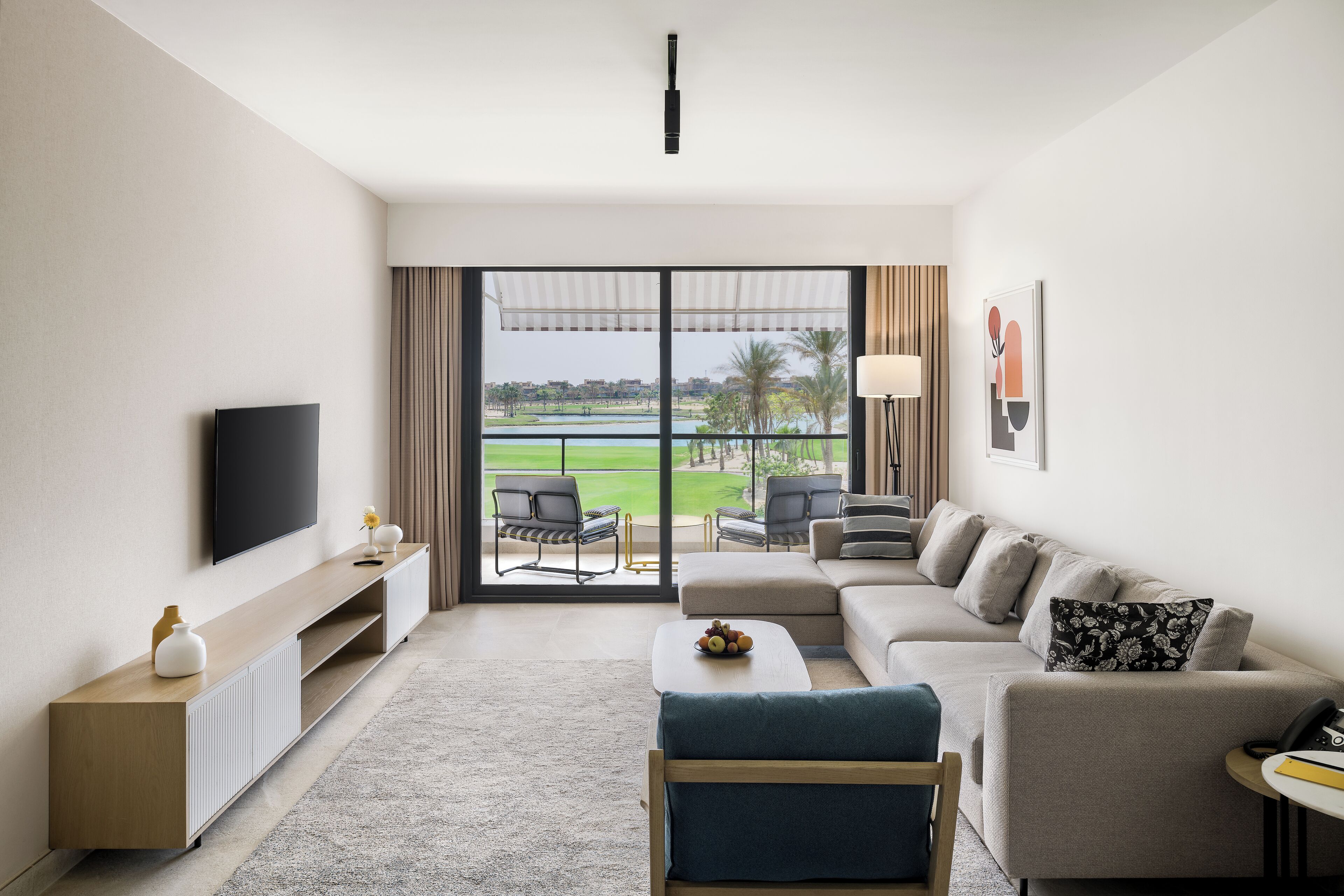 M-Suite Pool View | Minibar, in-room safe, blackout drapes, iron/ironing board