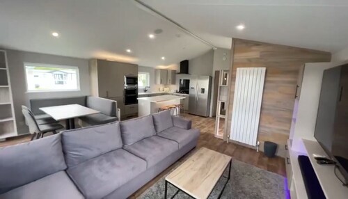 Relax at our lodge with a hot tub and breathtaking views your perfect escape!