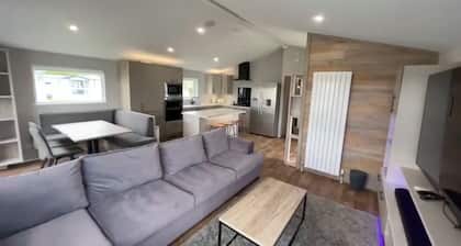 Relax at our lodge with a hot tub and breathtaking views your perfect escape!