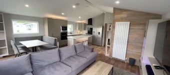 Relax at our lodge with a hot tub and breathtaking views your perfect escape!