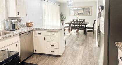 Beautiful Home in quiet neighborhood with a pool and close to stores & highways.