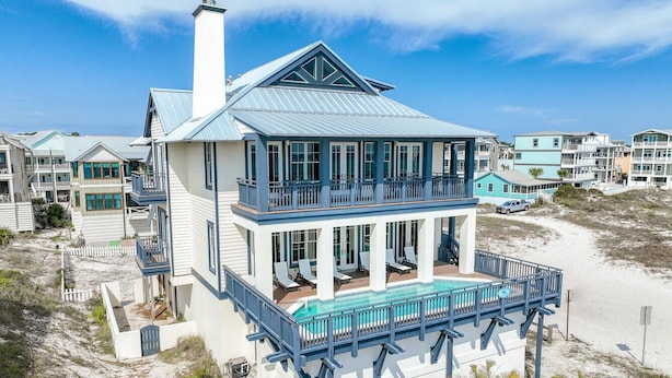 A beachfront house with a large balcony, a swimming pool, and a view of the beach. - Completely Renovated Gulf Front Home with Private Pool and Panoramic Views! (Santa Rosa Beach)