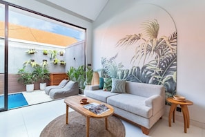 Deluxe Double Room, Garden View | Living area | 32-inch TV with digital channels - Cove Anantaha Loft & Villa (Seminyak)