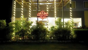 A hotel entrance with a sign reading "Bellagio Suites Hotel & Resort". -  Bellazio Suites Hotel and Resort Bellazio (Bareilly)