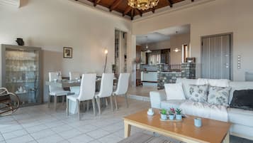 Superior Villa, Sea View | Living area | Flat-screen TV