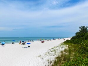 On the beach, sun loungers, beach towels