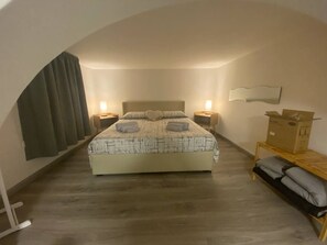 1 bedroom, desk, iron/ironing board, travel crib