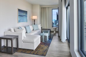 1 King Bed, Balcony, Corner Suite | Living area | 55-inch flat-screen TV with cable channels, Netflix, streaming services - Embassy Suites By Hilton Gulf Shores Beach Resort (Gulf Shores)
