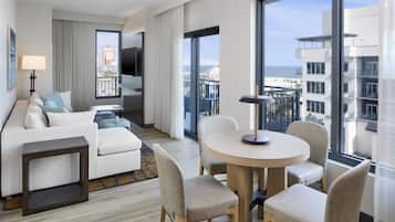1 King Bed, Balcony, Corner Suite | Living area | 55-inch flat-screen TV with cable channels, Netflix, streaming services