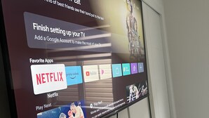 A television screen displaying a streaming service interface with options like Netflix and YouTube.