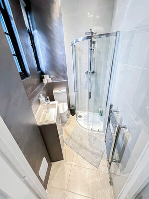 Shower, hair dryer, towels, soap