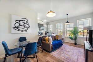 Superior Apartment | Living area | 70-inch Smart TV with digital channels - Modern Retreat Near Henry Ford (Detroit)