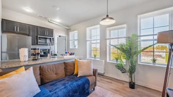 Superior Apartment | Living area | 70-inch Smart TV with digital channels