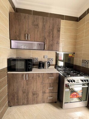 Fridge, microwave, oven, coffee/tea maker
