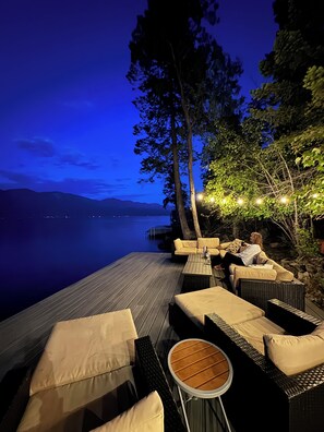 Evening glow on the dock under the Montana stars - Finley Point Lakefront Cottage with Dock, Boat Lift, and Treehouse Balcony (Polson)