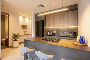 Fridge, microwave, stovetop, coffee/tea maker