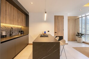 Fridge, microwave, stovetop, coffee/tea maker