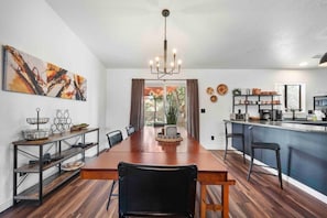 The dining room table has seating for six