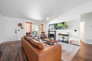 Large tv and fireplace in the living room