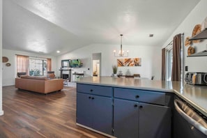 View of the living room and dining room from the kitchen. - Beautiful Home in West Sedona close to trails (Sedona)