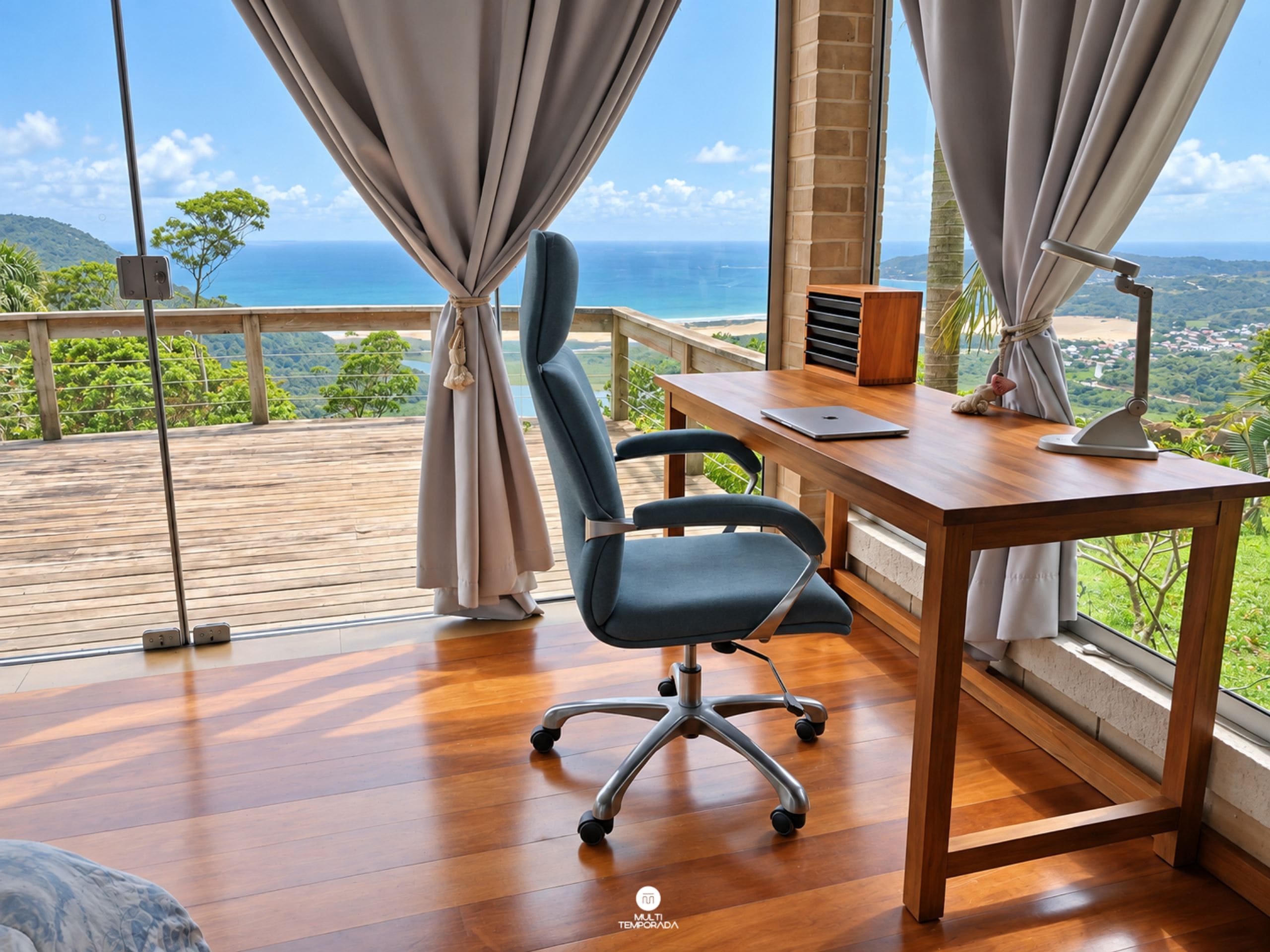A modern office space with a wooden desk, a chair, and a laptop. There is a large window with curtains, offering a view of the ocean and greenery.