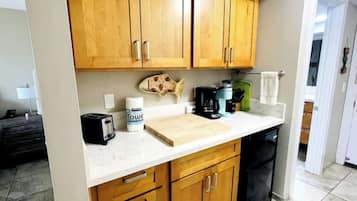 Fridge, coffee/tea maker, electric kettle, cookware/dishes/utensils