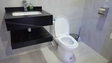 Twin Room, Courtyard View | Raised toilet seat