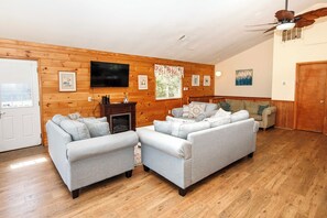 TV, fireplace, books - Oceanside, Private Pool, Hot Tub, OS4N, Kaerolla Dawn (Corolla)