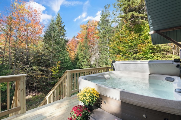 Hot tub on the back deck, for relaxing away your busy day out exploring nature.