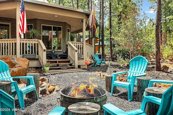 Outdoor genuine wood burning fire pit for year-round use. Seating for 8