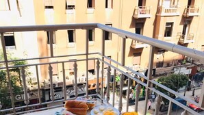A balcony with a variety of food items including bread, eggs, and bananas. - Park Plaza hotel (Cairo)