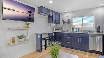 Fridge, stovetop, dishwasher, coffee/tea maker