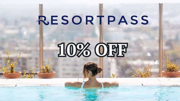 A person in a pool with a city view, potted plants, and text indicating a 10% off offer.