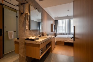 A modern hotel room with a large mirror, dual sinks, a walk-in closet, a bed, and a large window with curtains. - Dayin Serene Garden Hotel - Shanghai Jing'an Joy City Suzhou Creek (Shanghai)
