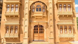 A large, ornate building with multiple windows and a central entrance. - Hotel Dev Villa (Jaisalmer)