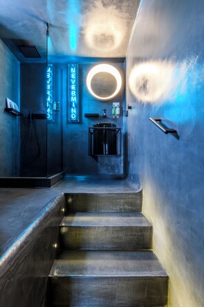 A modern bathroom with a glass shower enclosure, a sink, and a mirror. - She Mykonos Boutique Hotel (Mykonos)