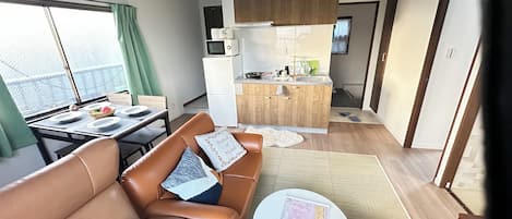 Economy Apartment, Non Smoking | Living area | Flat-screen TV