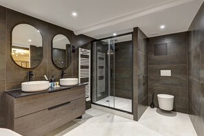 Shower, hair dryer, towels, soap