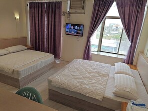 Chambre Quadruple | Coin séjour