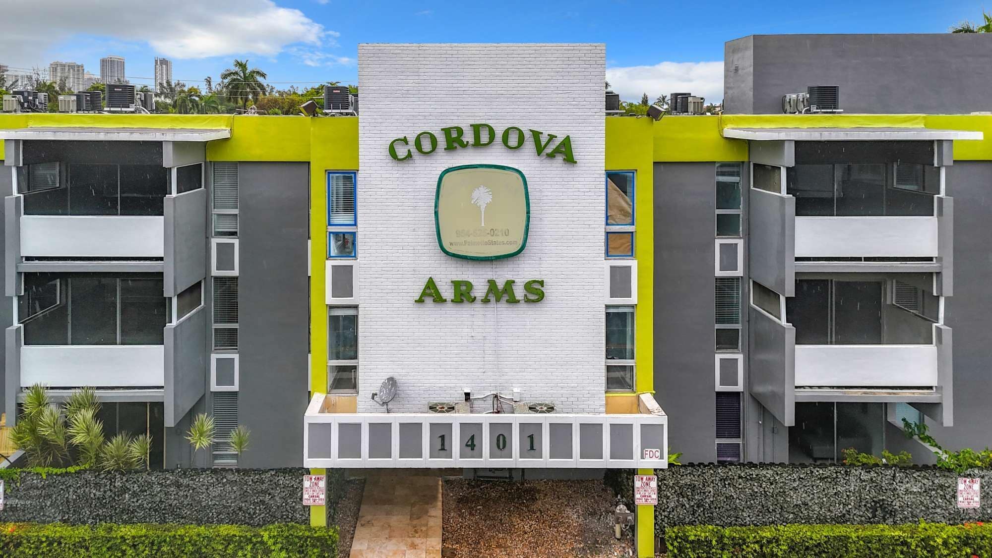 A modern building with the sign "CORDOVA ARMS" and a contact number.